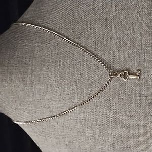 NWOT Silver tone chain and key charm
